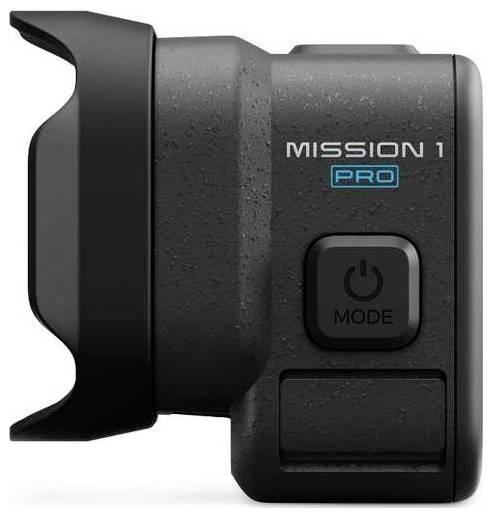 Kompaktní černý fotoaparát příslušenství označené "MISSION 1 PRO" s tlačítkem napájení "MODE" a připevněním na straně.