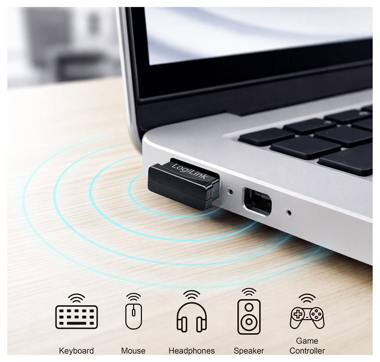 USB bezdrátový adaptér zapojený do notebooku se signálními kruhy a ikonami ukazujícími připojení klávesnice, myši, sluchátek, reproduktoru a herního ovladače.