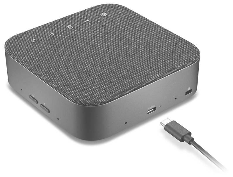 Kompaktní šedý přenosný reproduktor s texturovaným vrcholem, ovládacími tlačítky a USB-C kabelem vedle něj na bílém pozadí.
