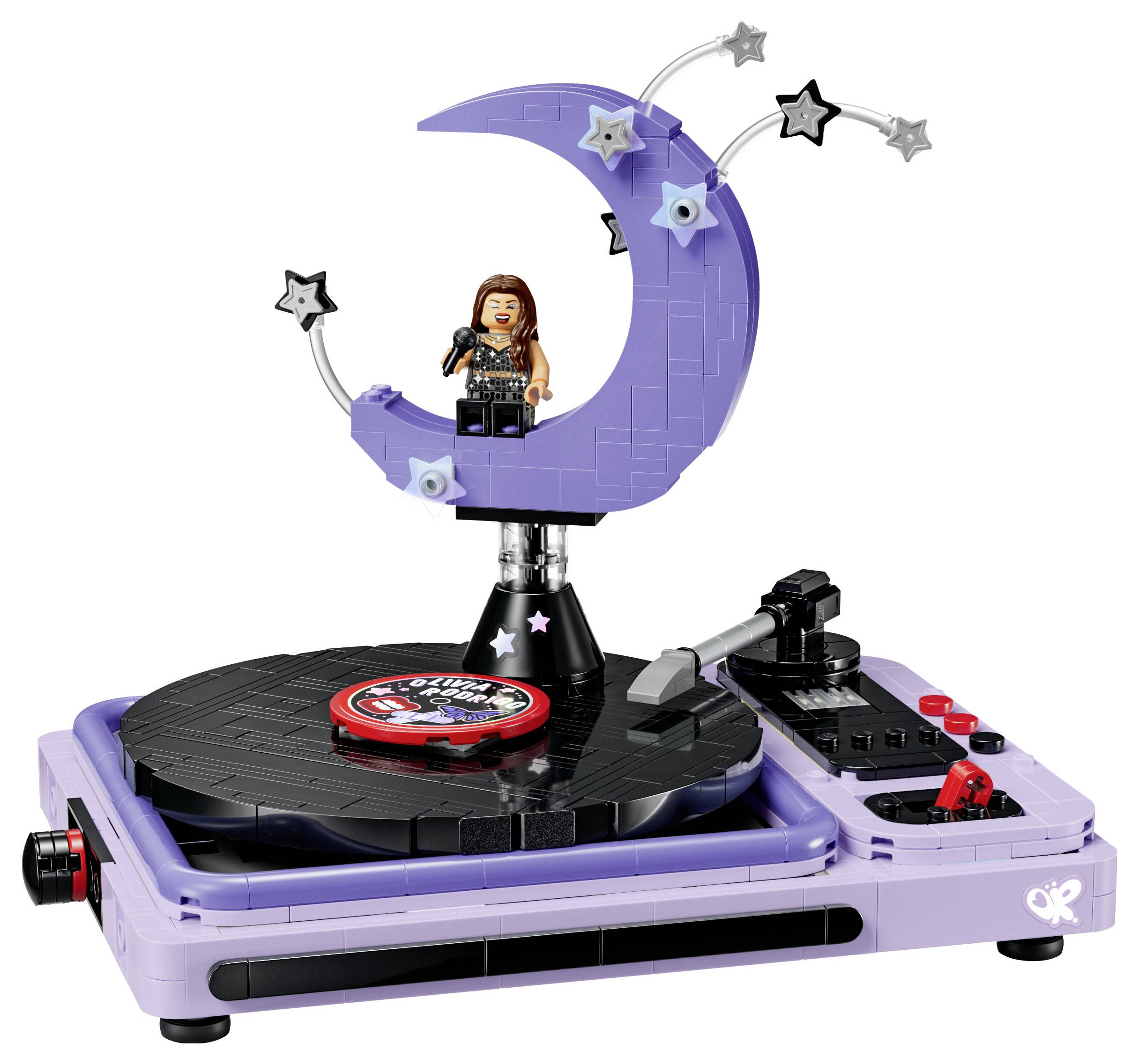 Fialový turntable ve stylu LEGO s měsíčkem a hvězdičkou na pódiu držící zpěvačku v podobě minifigurky.