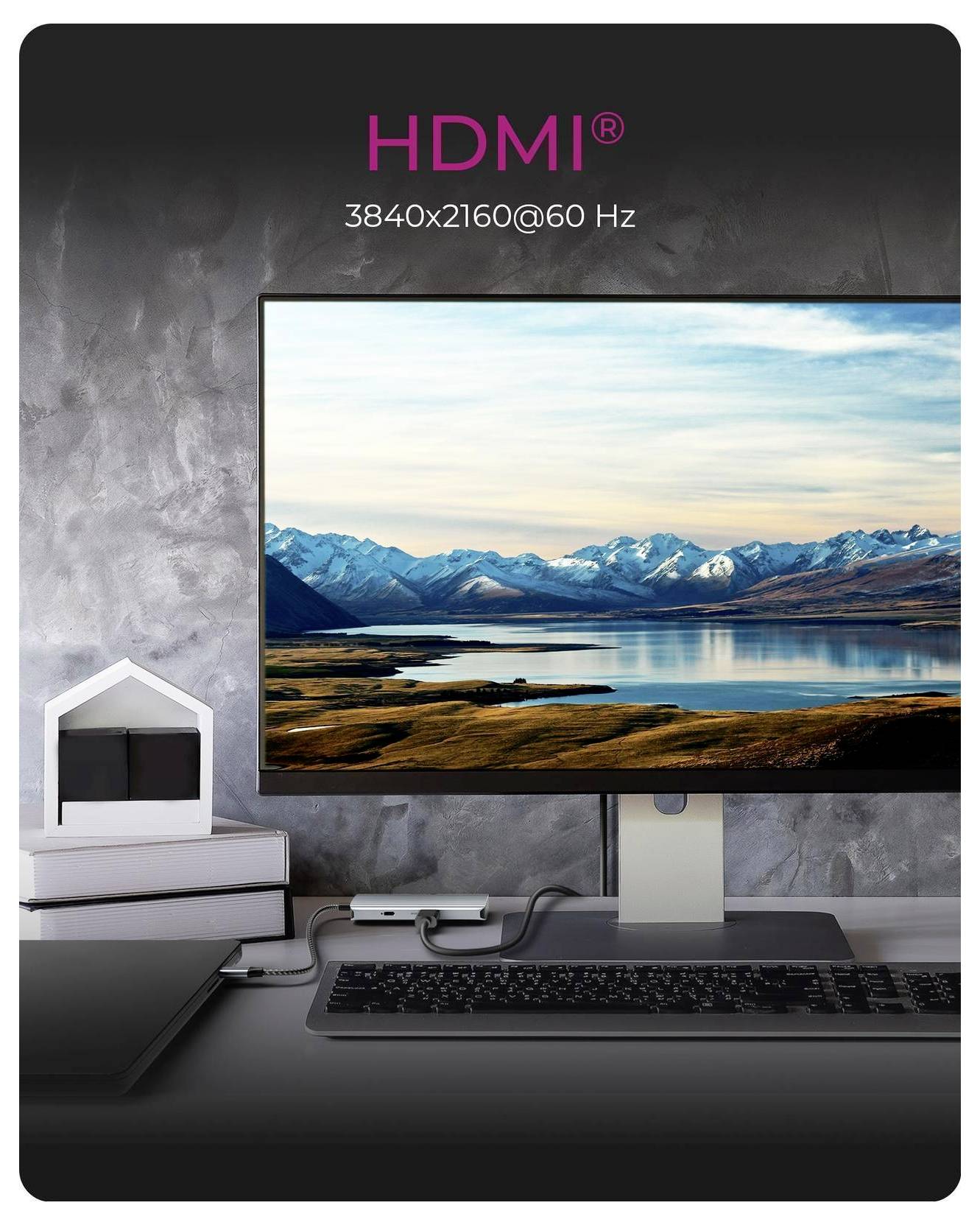 Desktopový monitor zobrazující horskou jezerní krajinu, s textem HDMI výše čtoucím "HDMI" a "3840x2160@60 Hz", což naznačuje podporu 4K displeje.