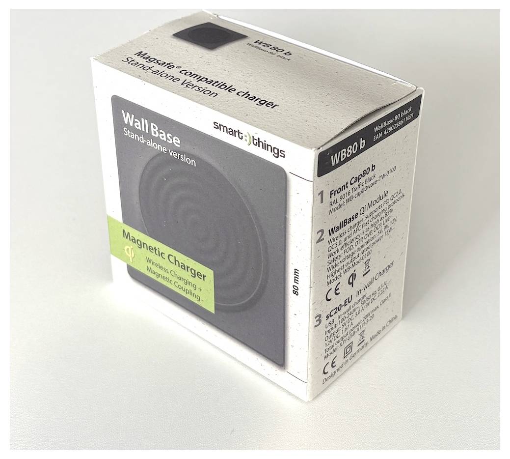 Krabice pro magnetickou nabíječku SmartThings Wall Base, zobrazená jako balení produktu na bílém pozadí.