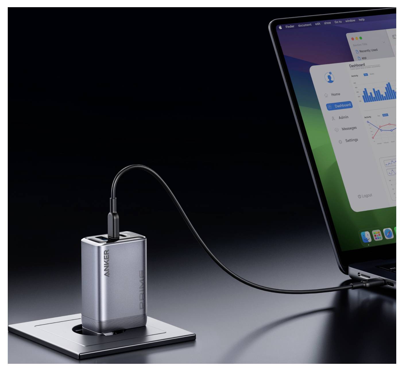 Stříbrná powerbank Anker nabíjí notebook prostřednictvím kabelu USB-C, přičemž obrazovka notebooku zobrazuje panel a grafy.