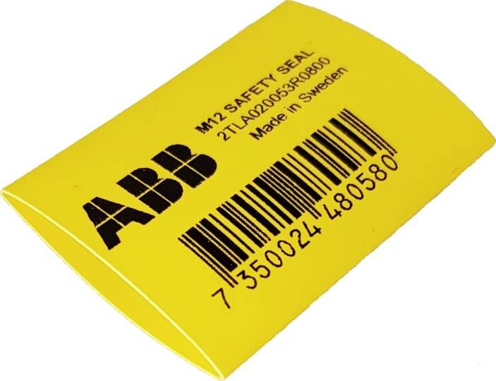 Žlutá bezpečnostní pečeť ABB M12 se čárkovým kódem a textem produktu, zobrazená na bílém pozadí.
