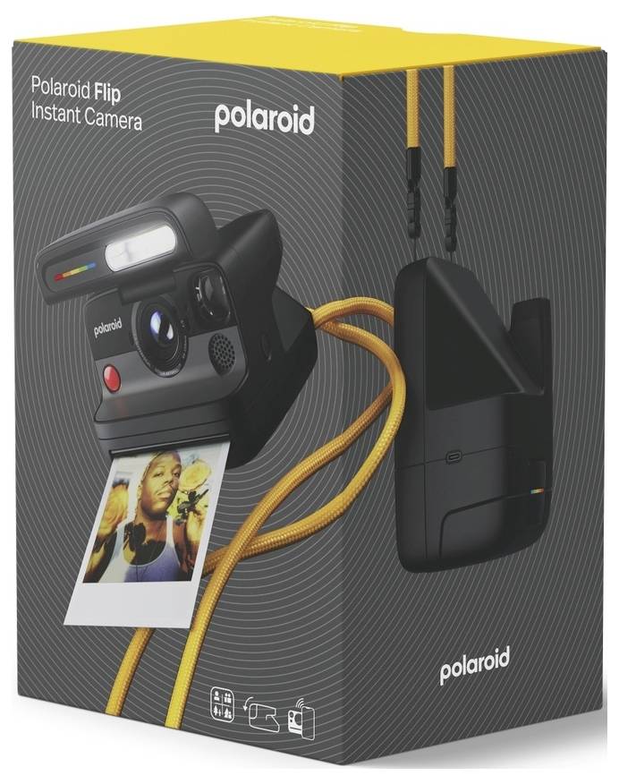 Polaroid Flip instantní fotoaparát - krabice s fotoaparátem, vytištěnou fotografií a černou nabíjecí stací se žlutým páskem