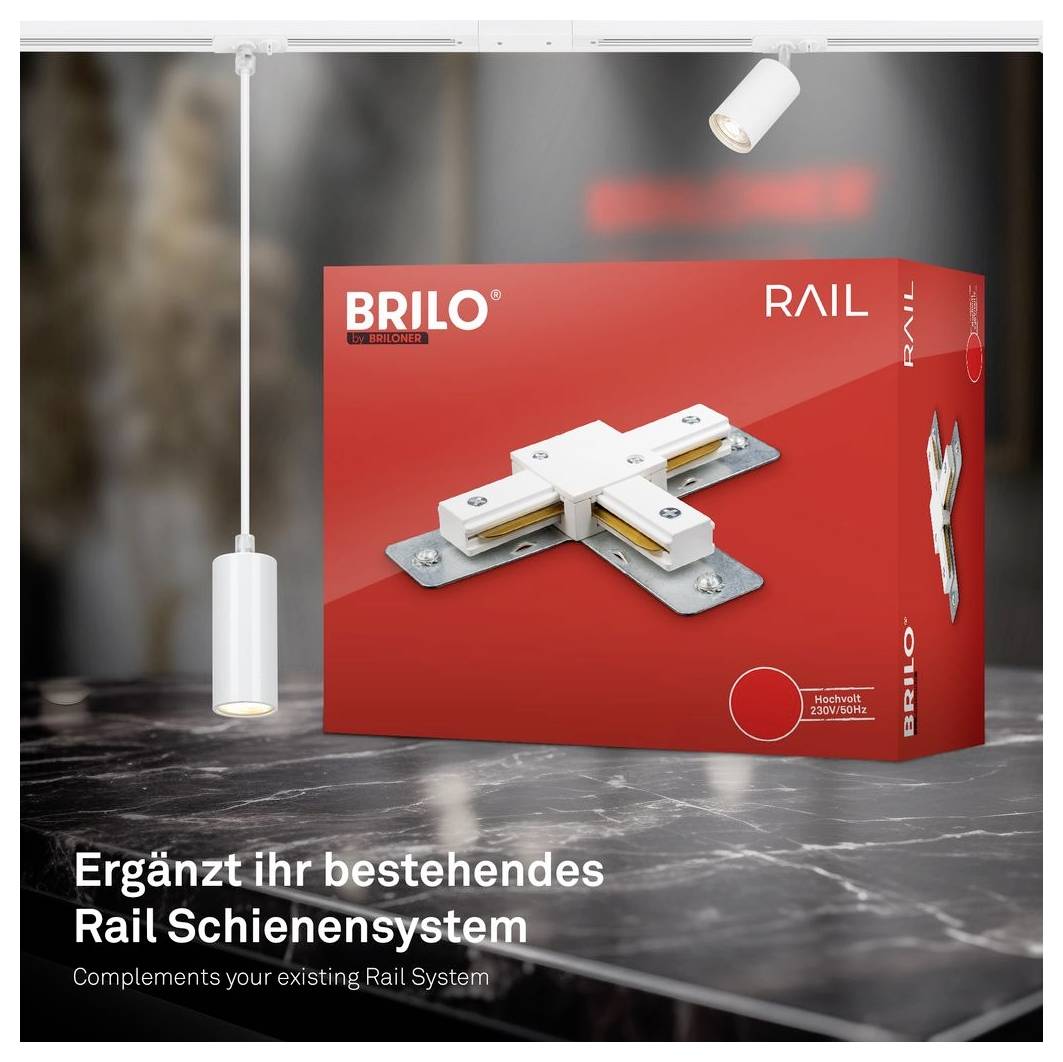 BRILO Rail produktová krabice s konektorem do lišty, zobrazená jako doplněk k existujícímu systému kolejnicového osvětlení; text zní "Doplňuje váš stávající kolejnicový systém" a "Complements your existing Rail System".