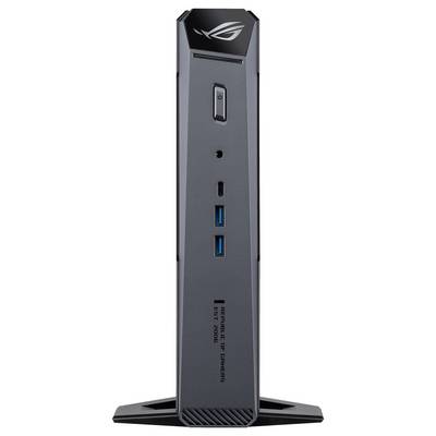 Přední pohled na tenký černý ASUS ROG mini PC stojící vzpřímeně na stojanu, ukazující tlačítko napájení a přední porty USB.