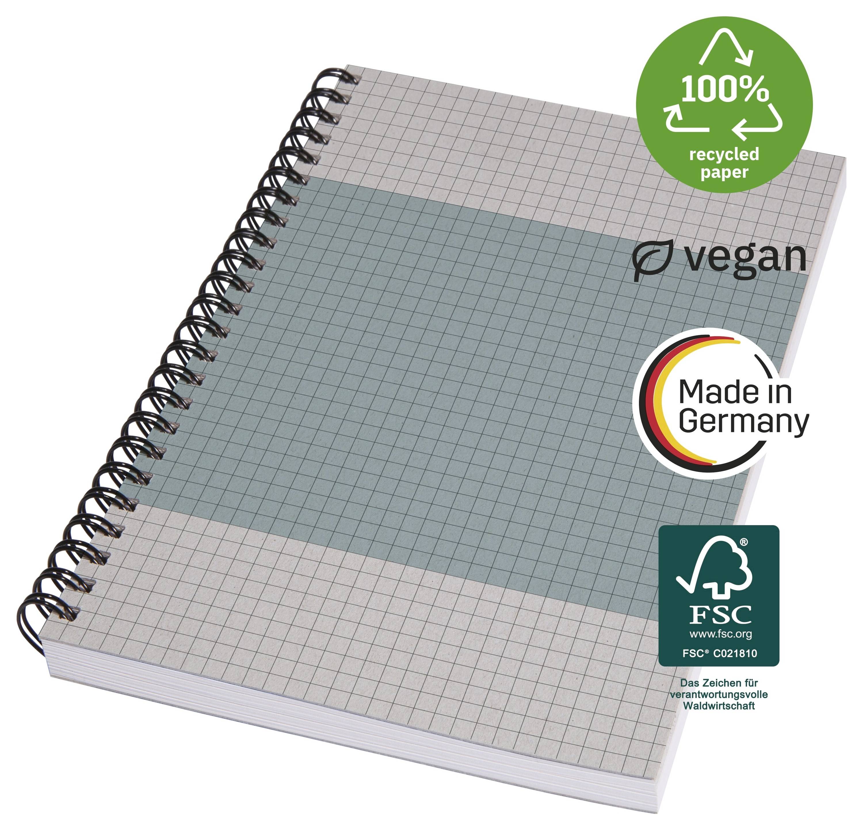 Spirálově vázaný sešit milimetrového papíru se značkami „100% recyklovaný papír", veganský, vyrobeno v Německu a certifikace FSC.