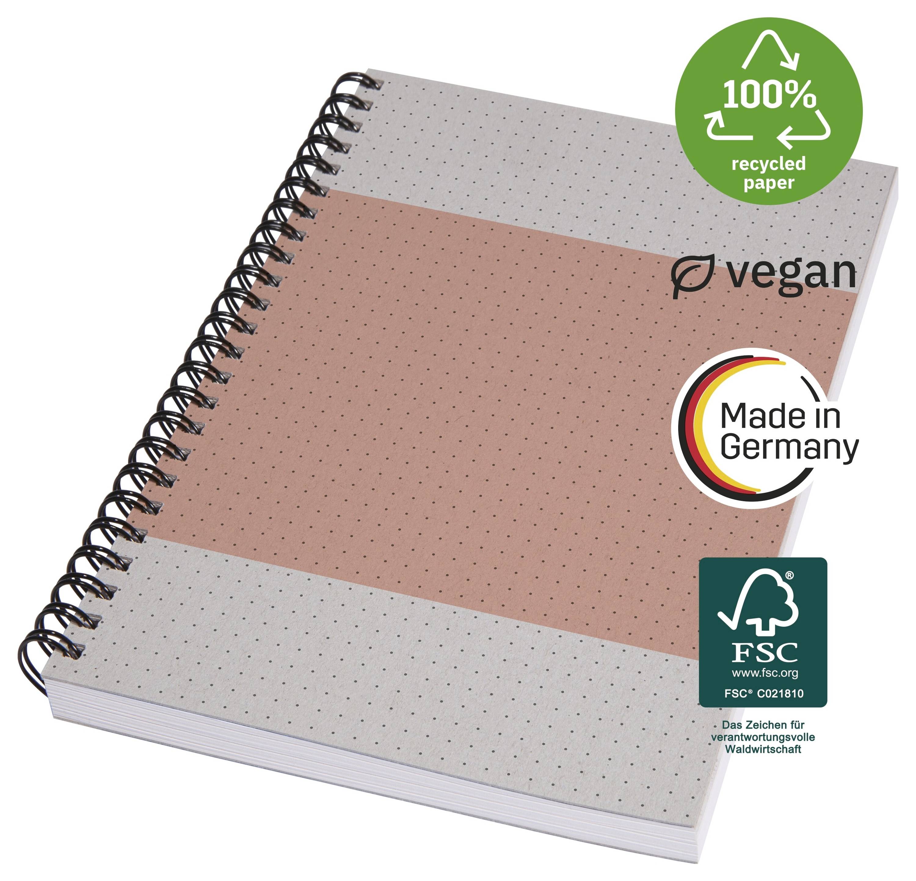 Kroužkový zápisník s tečkovaným obalem, označený jako „100% recyklovaný papír", „veganský", „Vyrobeno v Německu" a certifikovaný FSC.