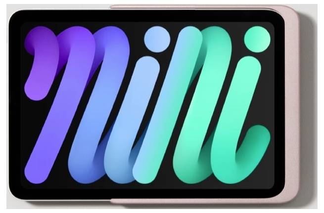 Na obrazovce tabletu se zobrazuje barevné stylizované logo "mi" v purpurové, modré a zelené barvě na černém pozadí.