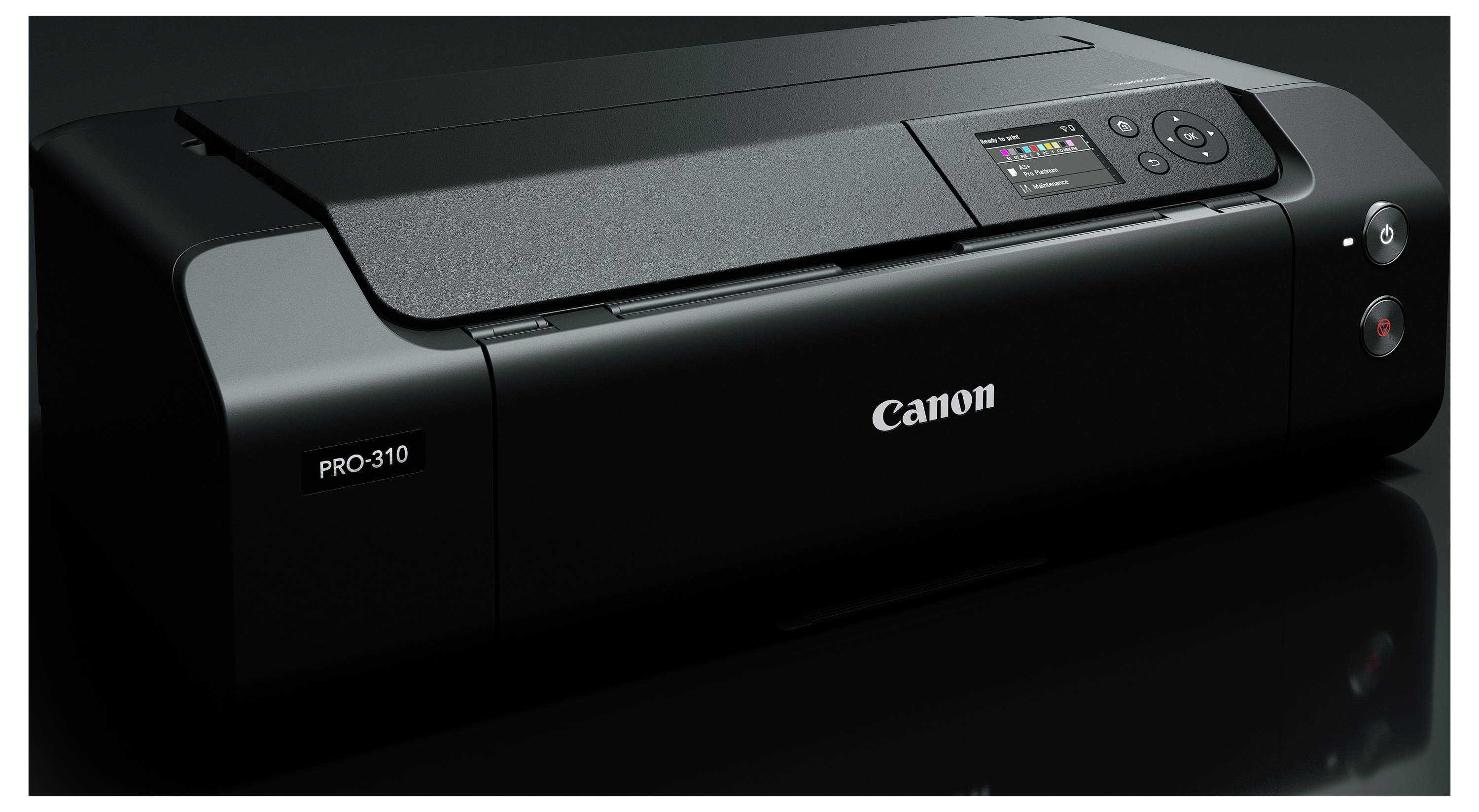 Fotoaparát Canon PRO-310 zobrazený v detailním záběru s viditelným ovládacím panelem a logem Canon.