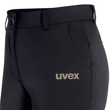 Černé pracovní kalhoty se smyčkami na opasek a logem „uvex" na stehně, zobrazené na jednobarevném pozadí.