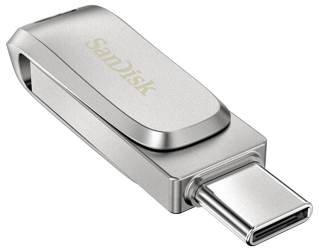 Stříbrná USB-C flash paměť SanDisk na bílém pozadí, zobrazená v detailním přiblížení s vysunutým konektorem.