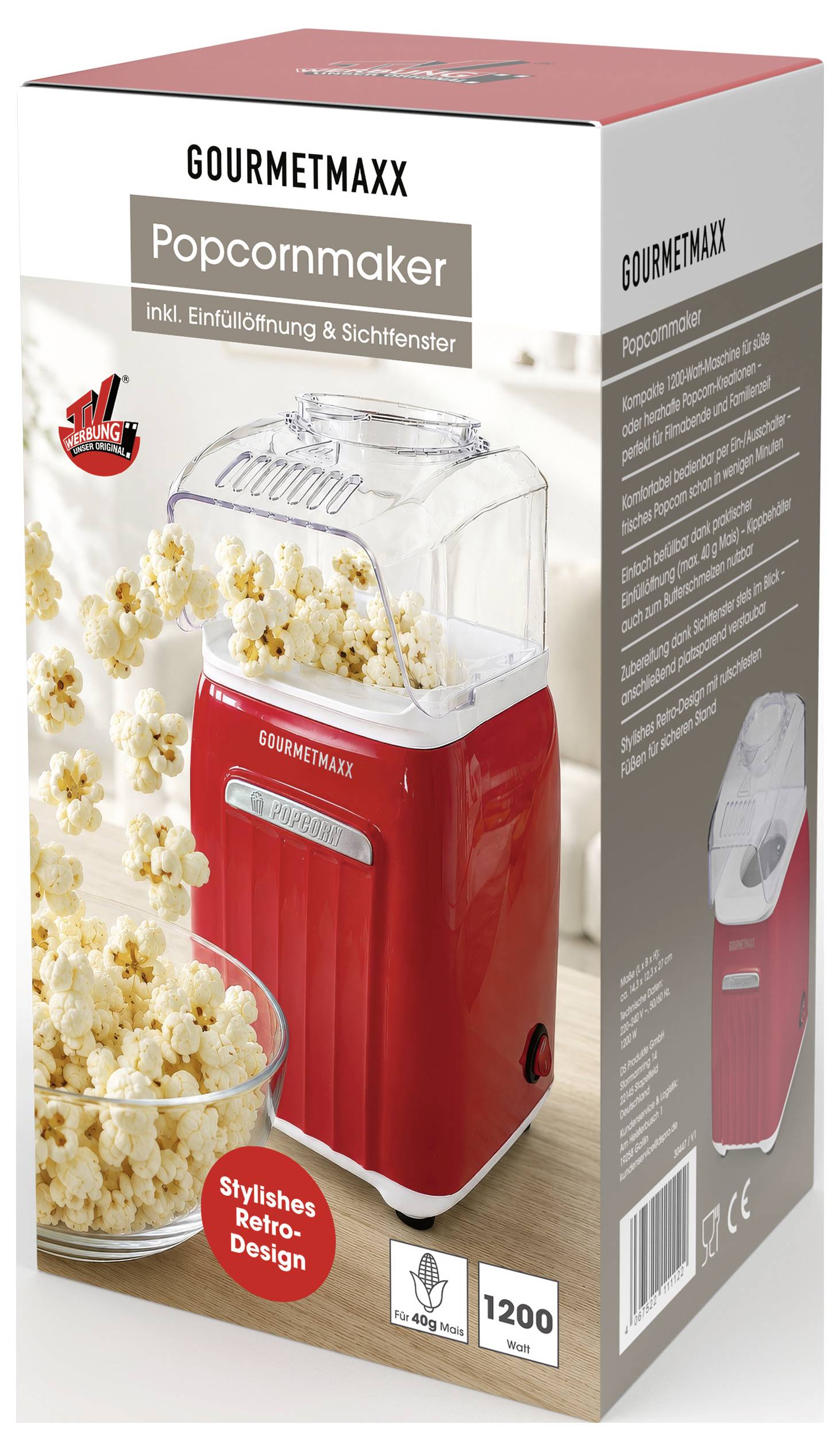 Krabice pro výrobník popcornu GOURMETMAXX, zobrazující červený vintage popcornový stroj ve stylu retro s číslem „1200" a textem „inkl. Einfüllöffnung & Sichtfenster" na obalu.