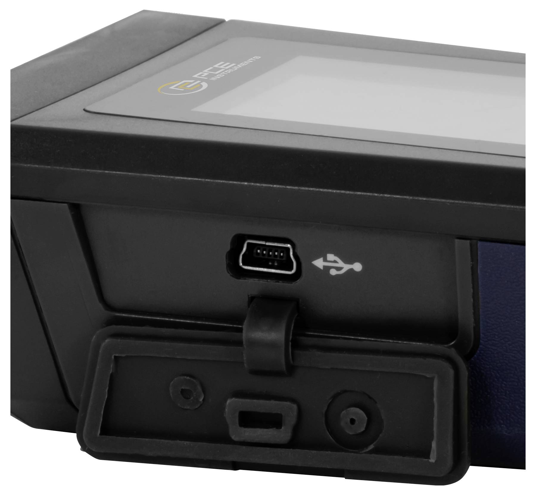 Detailní pohled na postranní panel zařízení zobrazující zakrytý port micro-USB označený symbolem USB, pravděpodobně určený pro nabíjení nebo přenos dat.