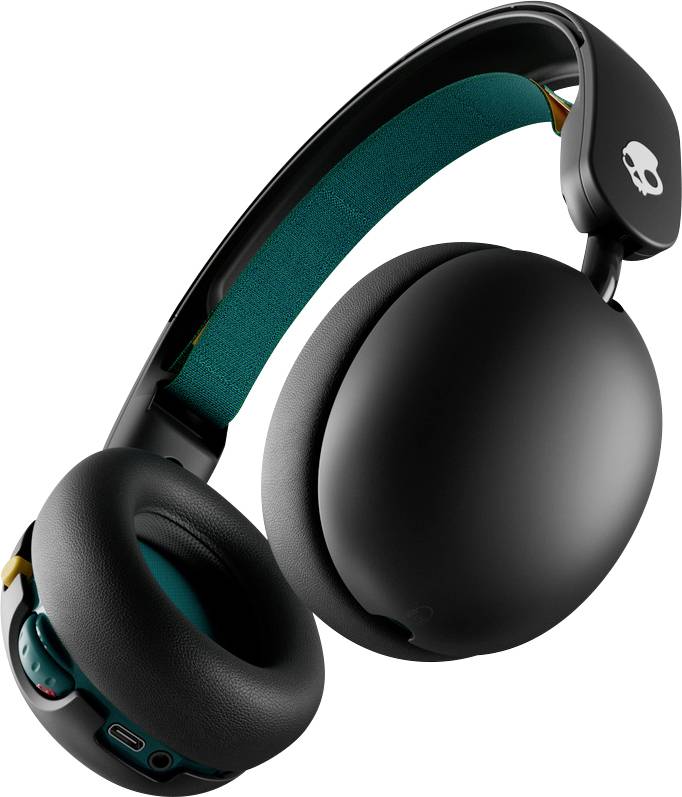 Černá sluchátka Skullcandy na uši s tyrkysovým vnitřním polstrováním a skládacím designem na bílém pozadí.