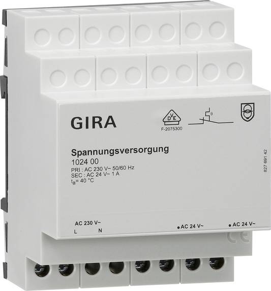 Modulární zdroj napájení GIRA označený 'Spannungsversorgung', se vstupními svorkami AC 230 V a výstupními svorkami AC 24 V, určený pro distribuci elektrické energie.