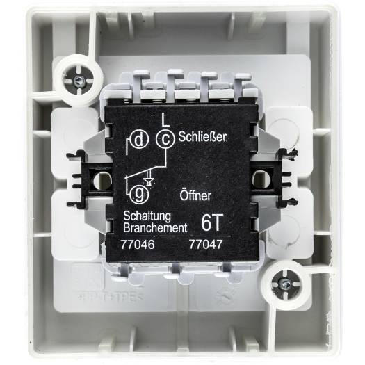 Modul elektrického vypínače v bílé nástěnné skříni, označený „Schließer", „Öffner", „Schaltung Branchment 6T", s elektrickým schématem a čísly svorek 77046 a 77047.
