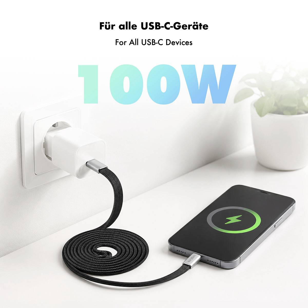 Obrázek v reklamním stylu znázorňující nabíječku USB-C do zásuvky nabíjející telefon s textem „Pro všechna zařízení USB-C" a „100W" označujícím rychlé nabíjení.