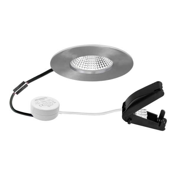 Vestavné LED bodové svítidlo se kulatým stříbrným rámečkem, připojeným napájecím modulem a pružinovou svorkou pro instalaci do stropu.