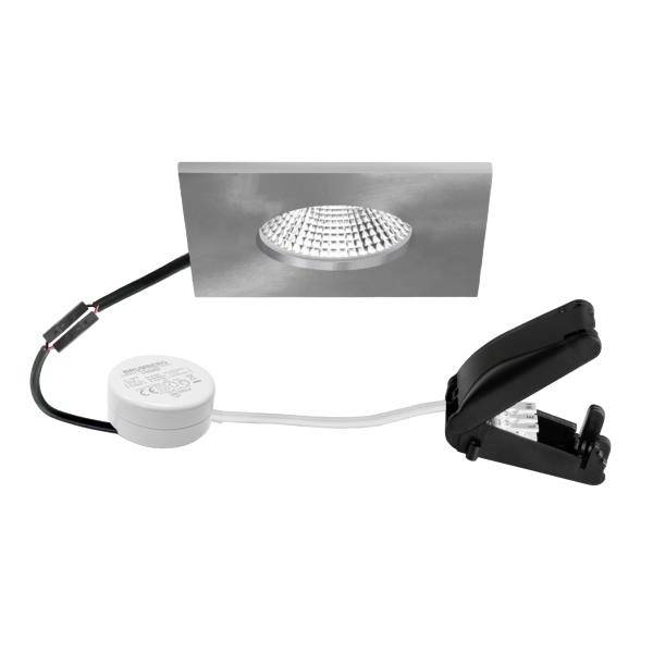 Bílé kulaté LED světlo s obdélníkovým ozdobným prvkem, připojovací kabel, řídicí modul a pružinový klip pro instalaci do podhladu.