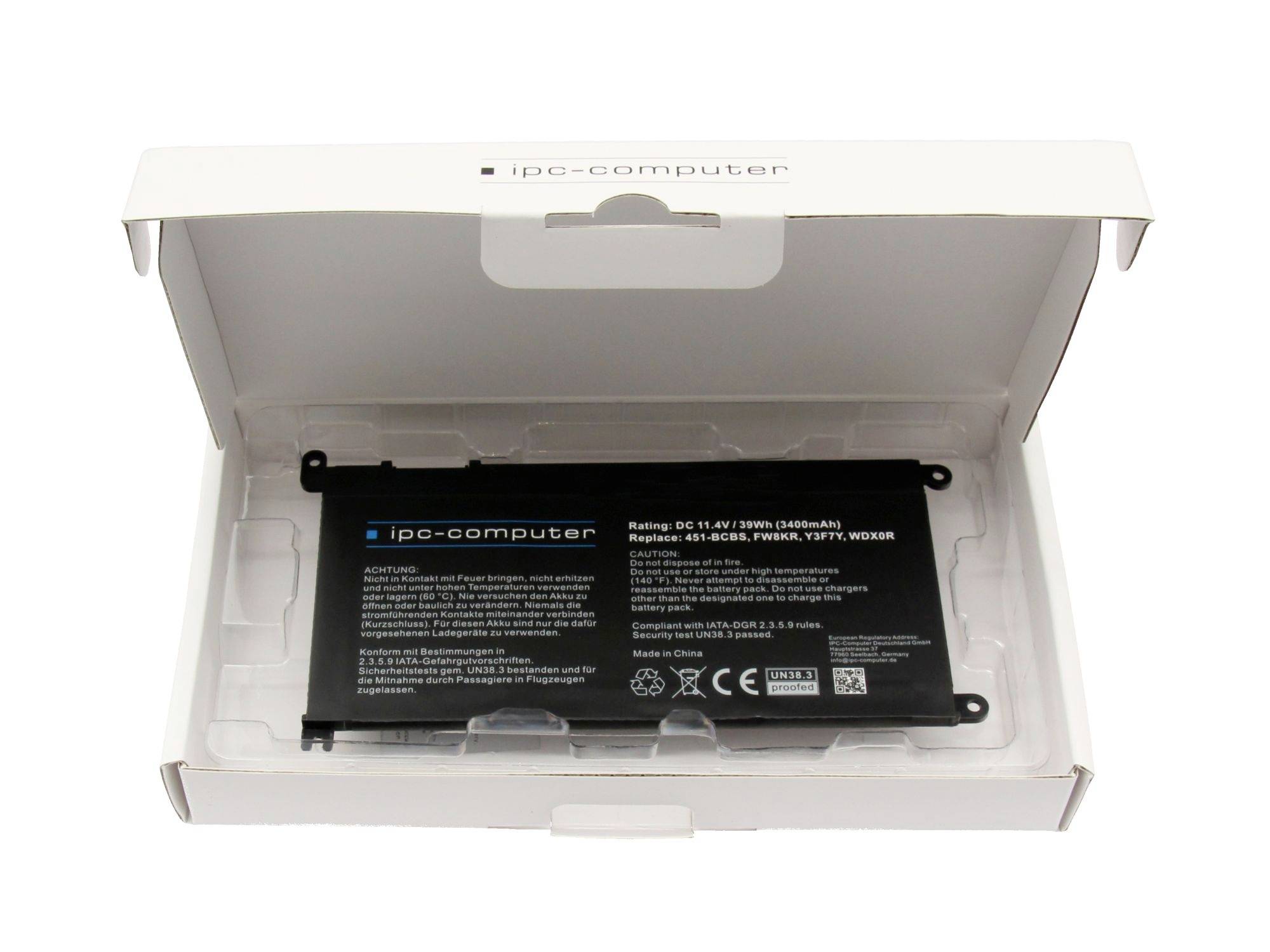 Baterie notebooku v otevřené bílé krabici „ipc-computer" s viditelnou černou náhradní baterií uvnitř balení.