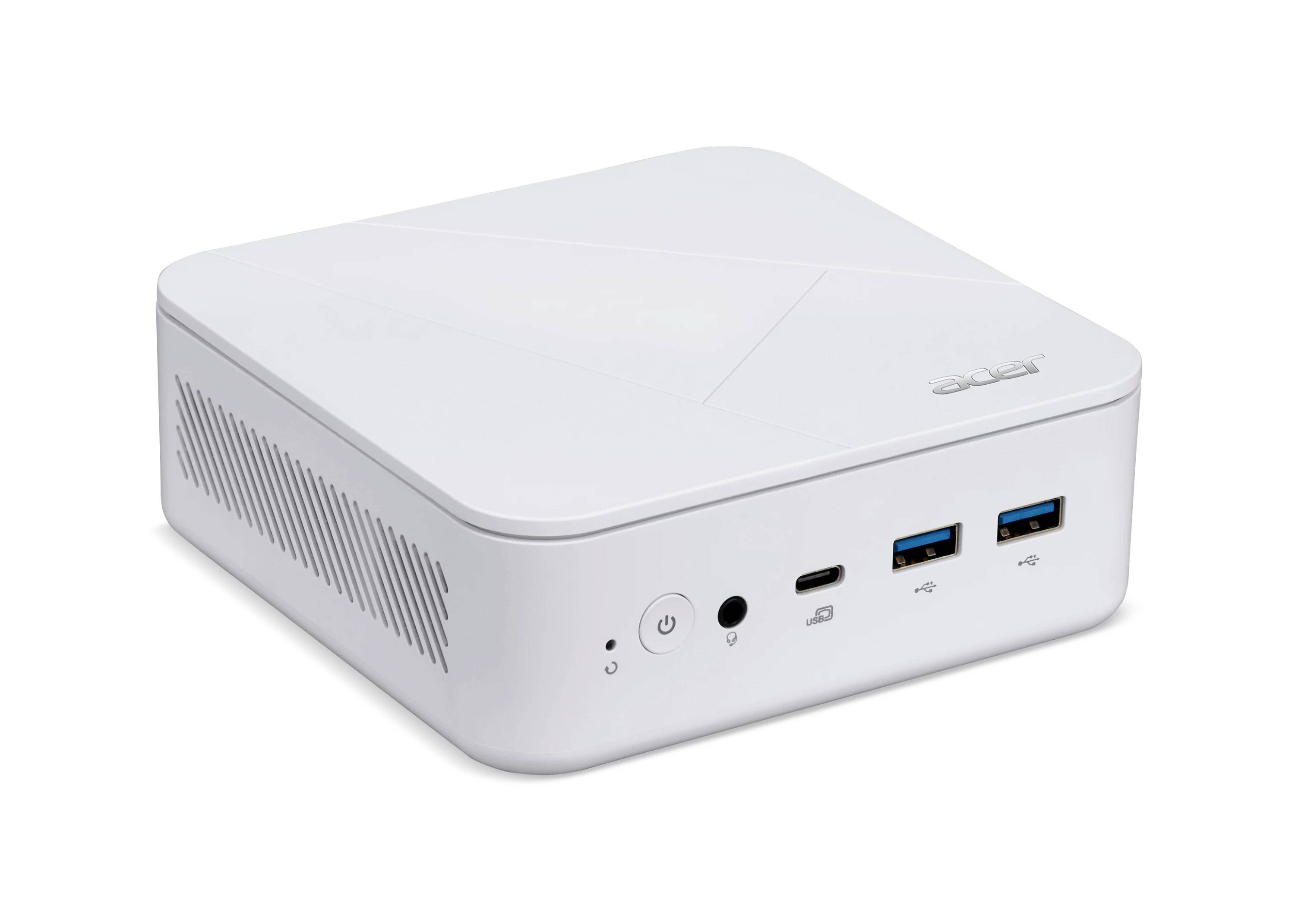 Bílý kompaktní mini stolní počítač s tlačítkem napájení, audio jackem, portem USB-C a dvěma porty USB-A na přední straně.