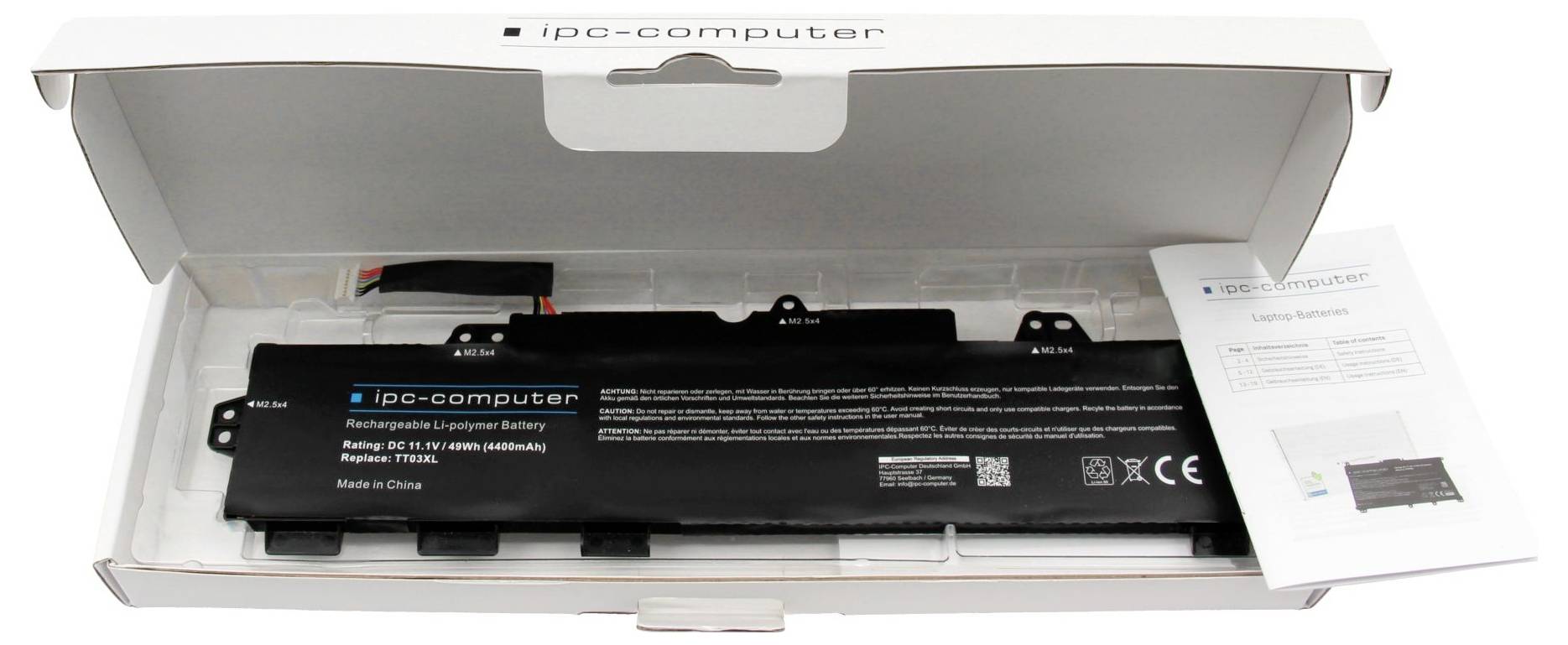 Baterie notebooku iPC-computer v otevřené bílé obchodní krabici s letákem s pokyny vedle ní.