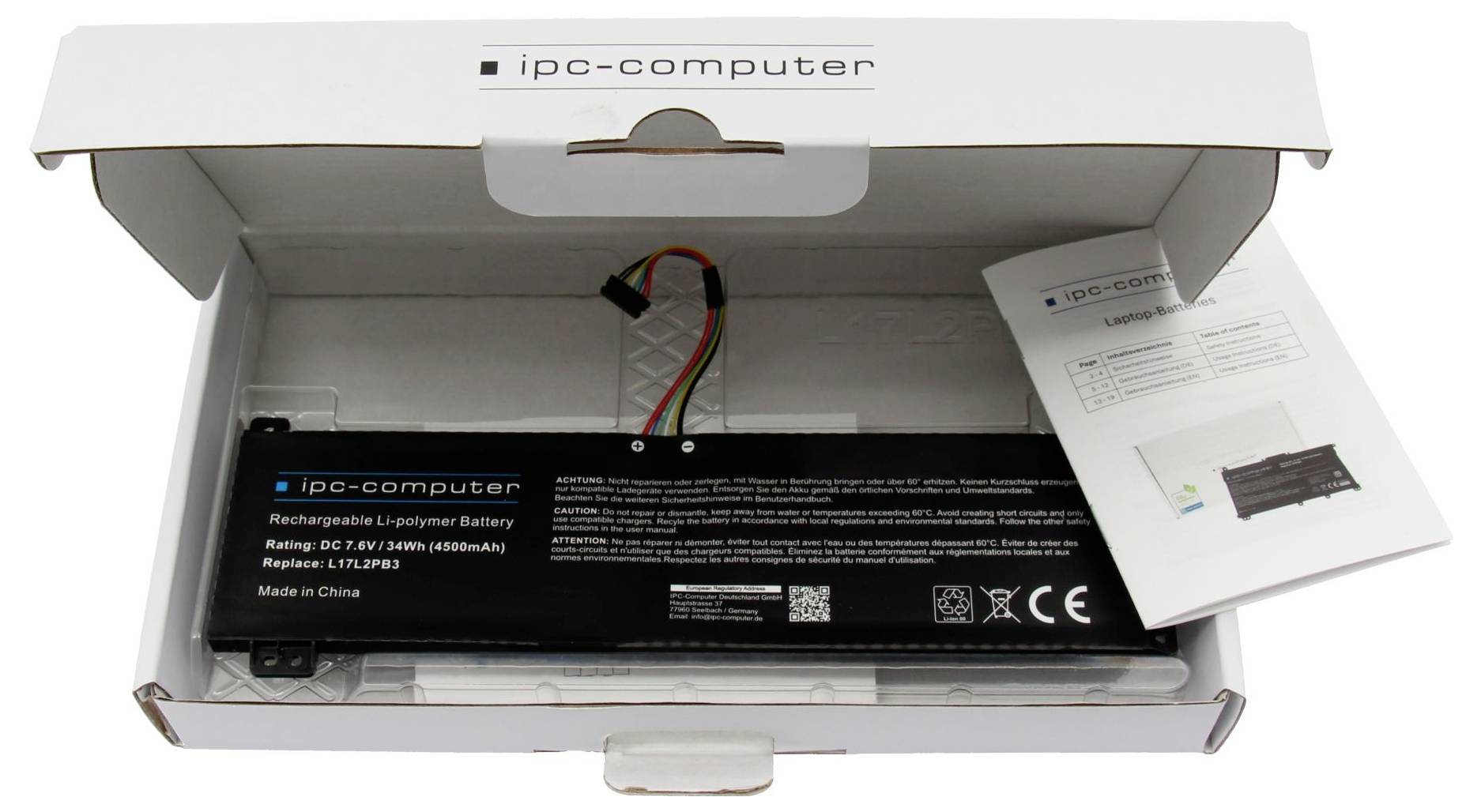Baterie notebooku v otevřené krabici počítače IPC s přeloženým letákem produktu