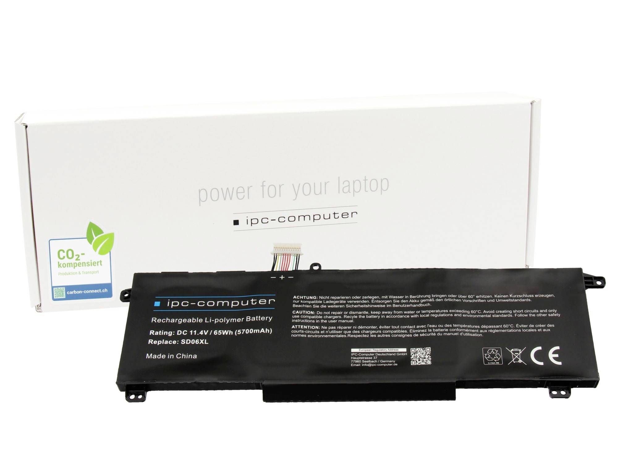 Černá náhradní baterie do notebooku označená "ipc-computer" před bílou krabicí produktu s logem CO2composit.