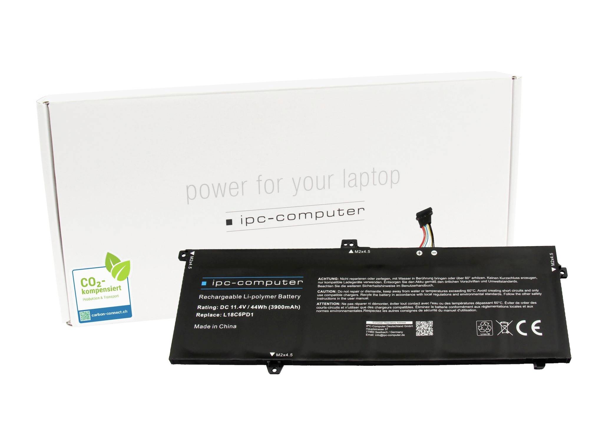 Náhradní baterie do notebooku zobrazená před jejím bílým balením počítače IPC, označená „Energie pro váš notebook" a CO2-kompenzovaná.