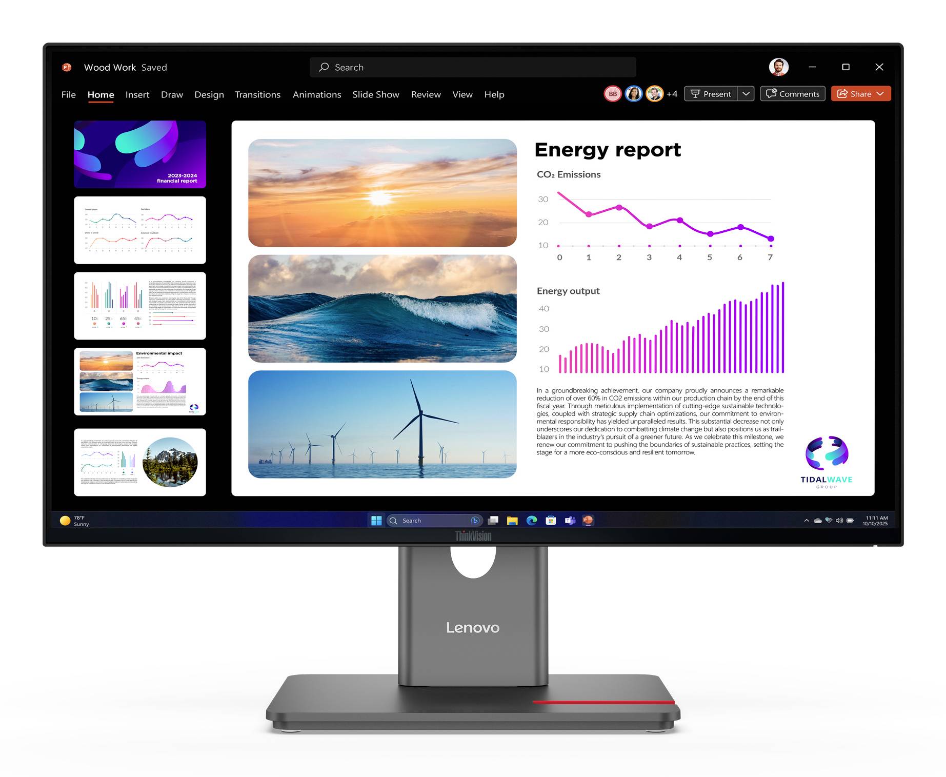 Monitor Lenovo zobrazuje prezentační snímek s názvem "Zpráva o energii" s fotografiemi obnovitelné energie a dvěma růžovými grafy znázorňujícími trendy emisí CO2 a výstupu energie.