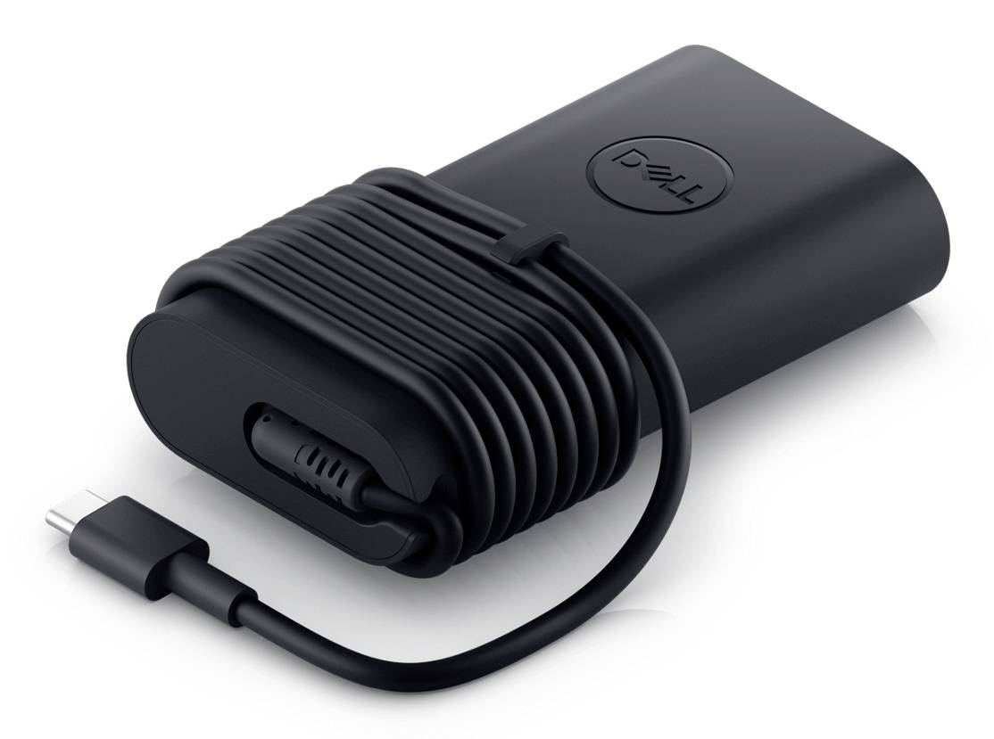 Černý napájecí adaptér Dell notebooku se stočeným kabelem a konektorem USB-C na bílém pozadí.