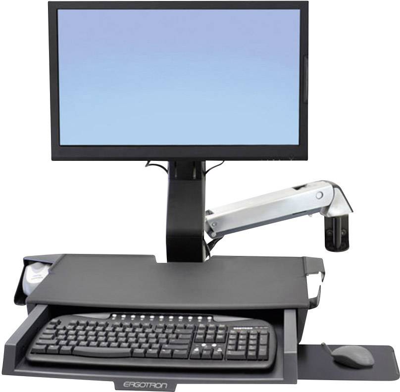 Počítačový monitor s nastavitelným ramenem, pod ním klávesnicový panel s klávesnicí. Toto uspořádání je navrženo ergonomicky.