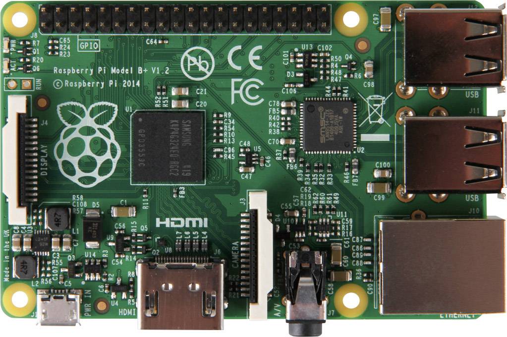 Deska Raspberry Pi Model B s několika konektory a komponenty. Horní strana ukazuje procesor, USB a HDMI porty.