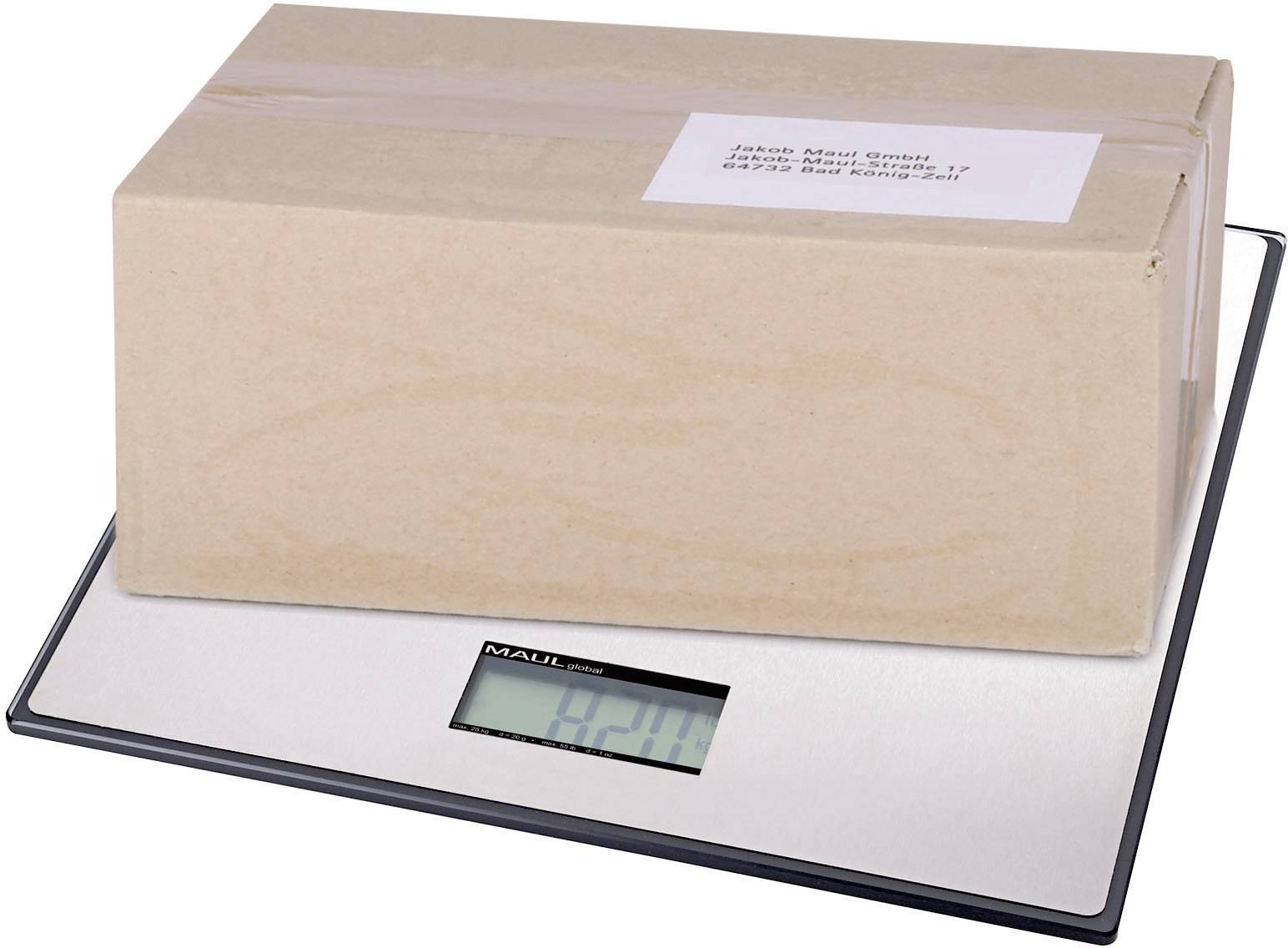 Kartonová krabice leží na digitální váze. Displej ukazuje '4,28 kg'. Na horní straně balíku je viditelná adresní nálepka.