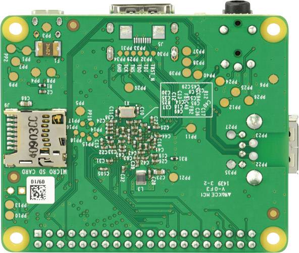 Zadní strana zelené desky plošných spojů s různými elektronickými komponenty, pájecími body a připojovacími body.