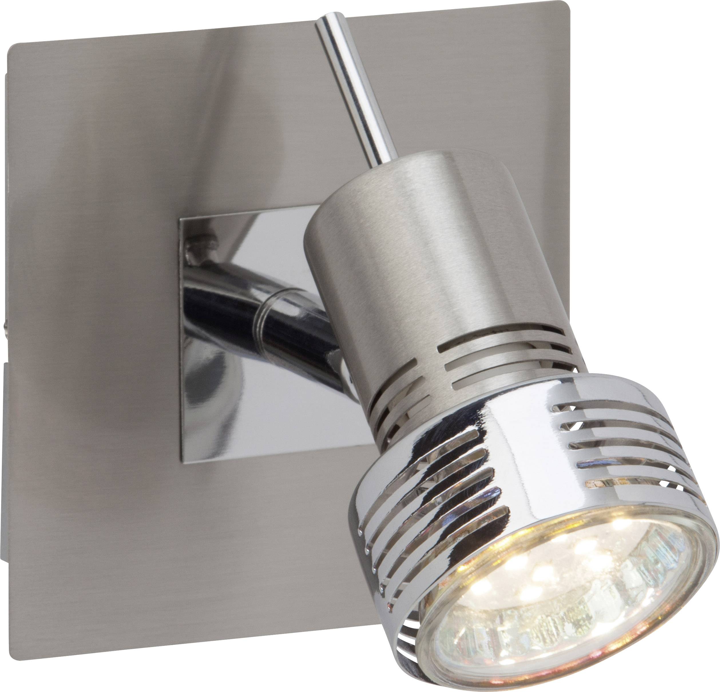 Kovová nástěnná lampa s nastavitelným válcovým stínidlem a viditelnou žárovkou. Upevněná na čtvercové základně.