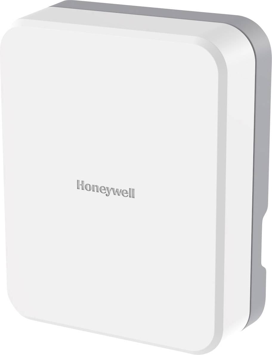 Bílé, obdélníkové zařízení se zaoblenými rohy, na kterém je napsáno 'Honeywell'.