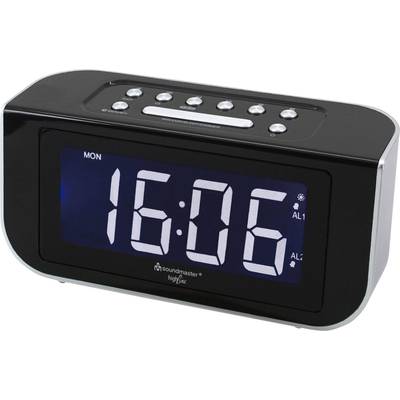 Digitální radiobudík s velkým displejem zobrazuje 'PON 16:06'. Nahoře ovládací tlačítka; jsou viditelné dva alarmové módy (AL1, AL2).