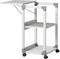 Bílý pojízdný servírovací vozík z kovu se třemi policemi a sklopným bočním stolkem.