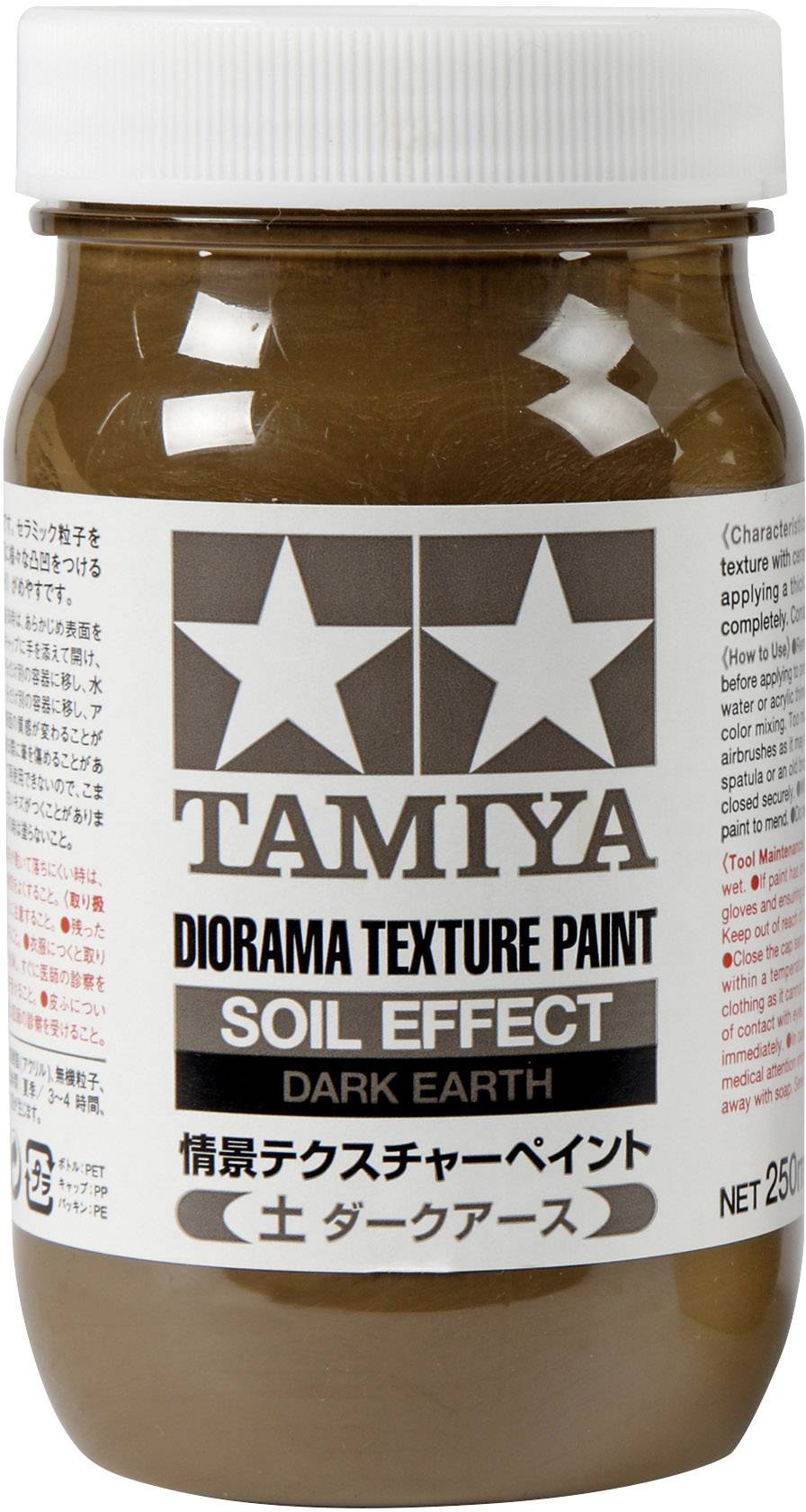 Hnědohnědá skleněná nádoba s nálepkou zobrazující "Tamiya Diorama Texture Paint Soil Effect Dark Earth" s japonskými znaky.