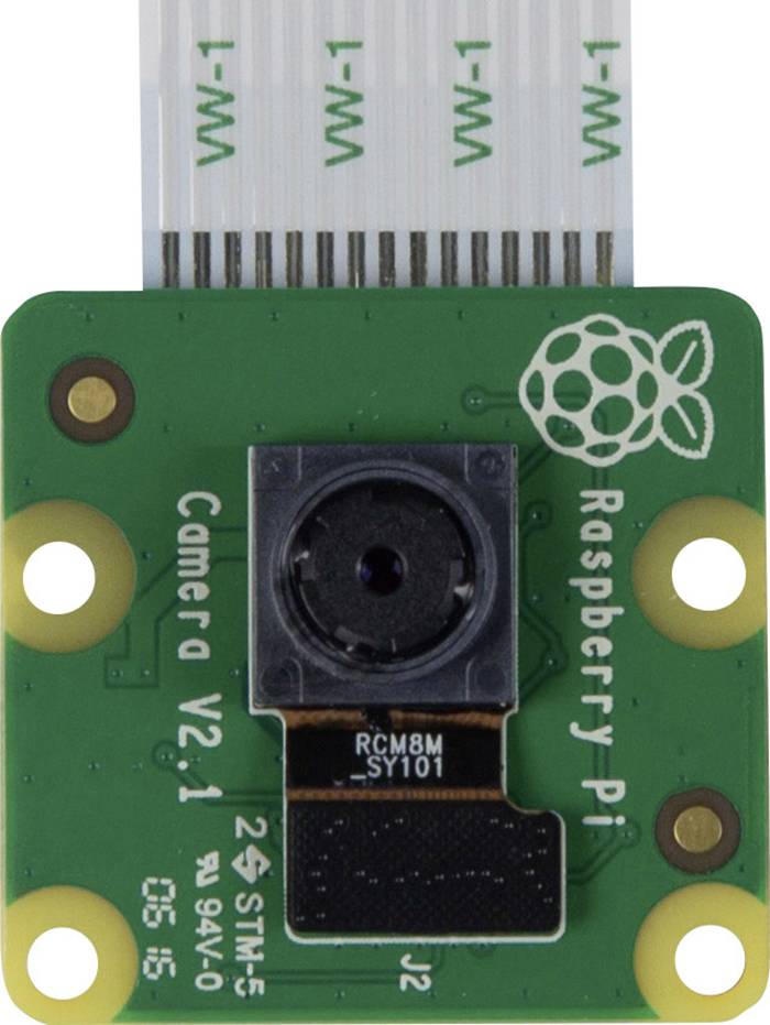 Malá deska s kamerou, označená 'Raspberry Pi Camera V2.1'. Obsahuje snímač uprostřed, plochý kabel připojený nahoře.