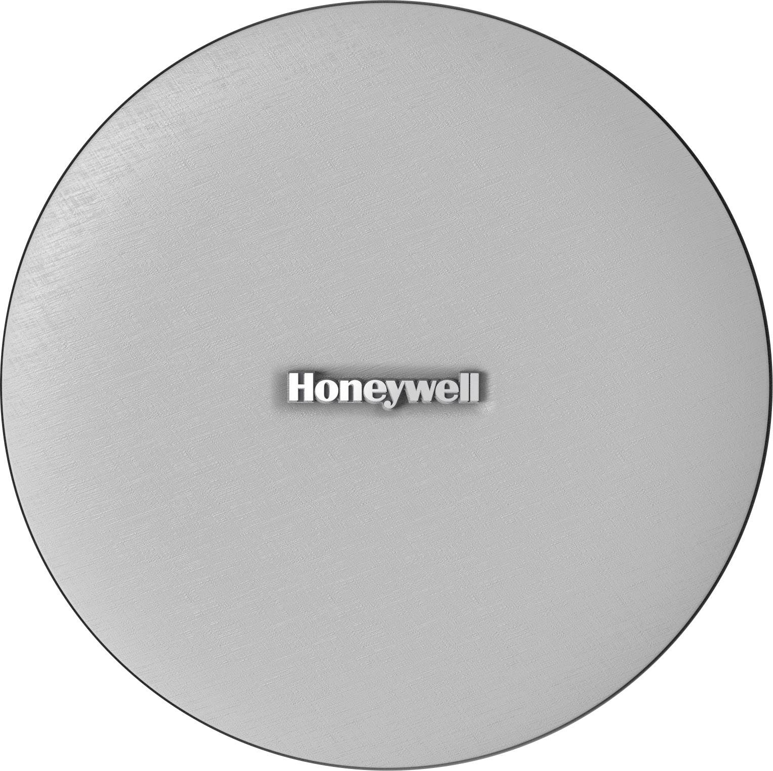 Kulatý předmět s kovovým povrchem, uprostřed nápis 'Honeywell' černým písmem na stříbrném pozadí.
