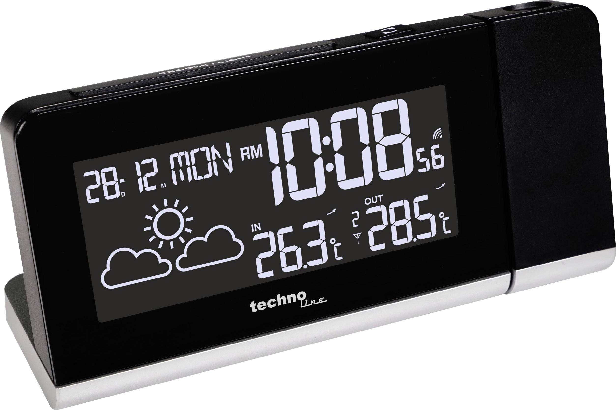 Černé digitální hodiny ukazují 10:08 dopoledne, s datem 28.12. a informacemi o počasí: slunce, oblačno, vnitřní teplota 26,3°C, venkovní teplota 28,5°C.