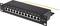 Černý patch panel s dvanácti očíslovanými ethernetovými porty a žlutým uzemňovacím kabelem, označený štítkem "CAT.6A".