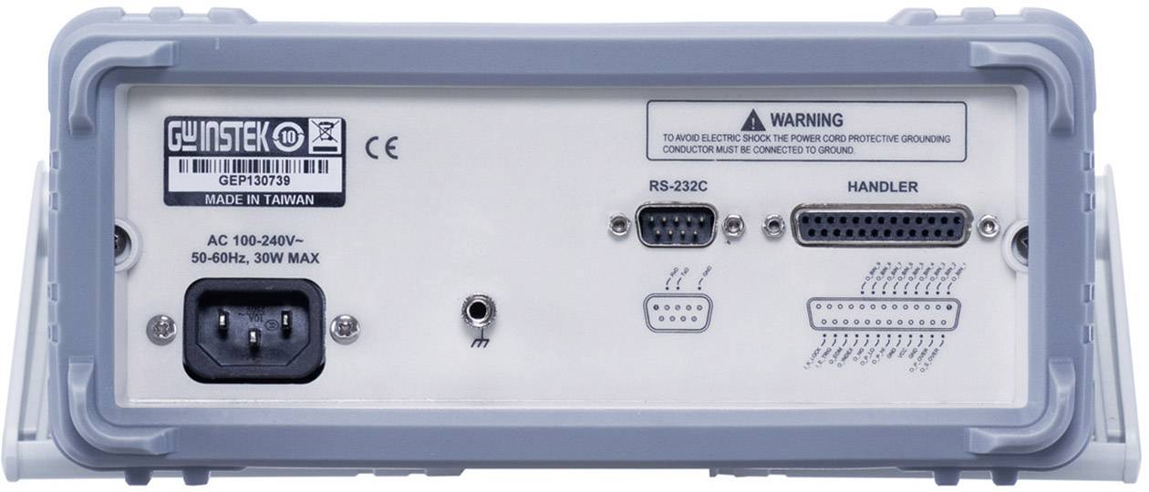 Zadní pohled na elektrické zařízení s několika konektory, včetně RS-232C a napájecího vstupu střídavého proudu. Jsou zde přítomny výstražné štítky.