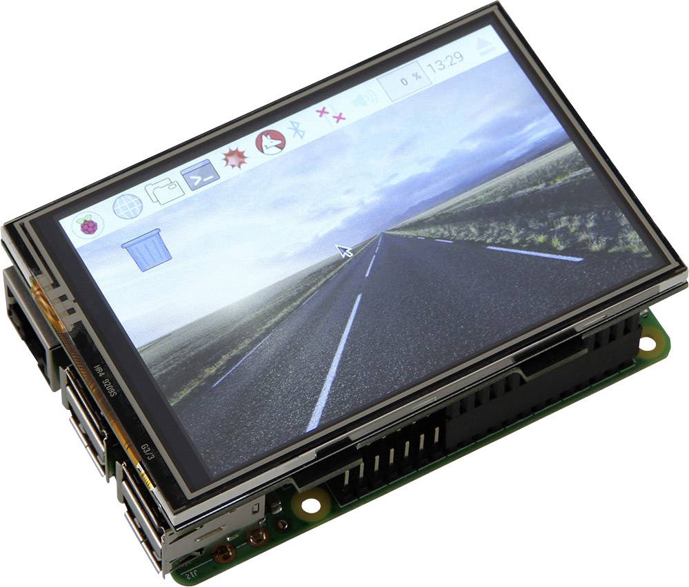 Elektronický displej s obrázkem prázdné silnice a lištou ikon nahoře, umístěný na malé desce plošných spojů s konektory.