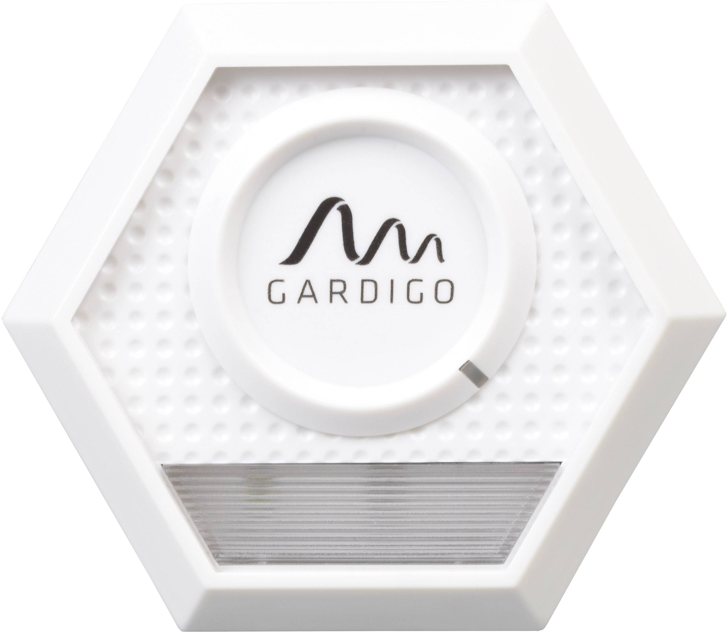 Bílé šestihranné zařízení s nápisem 'GARDIGO', pravděpodobně elektronický výrobek určený pro vnitřní použití.