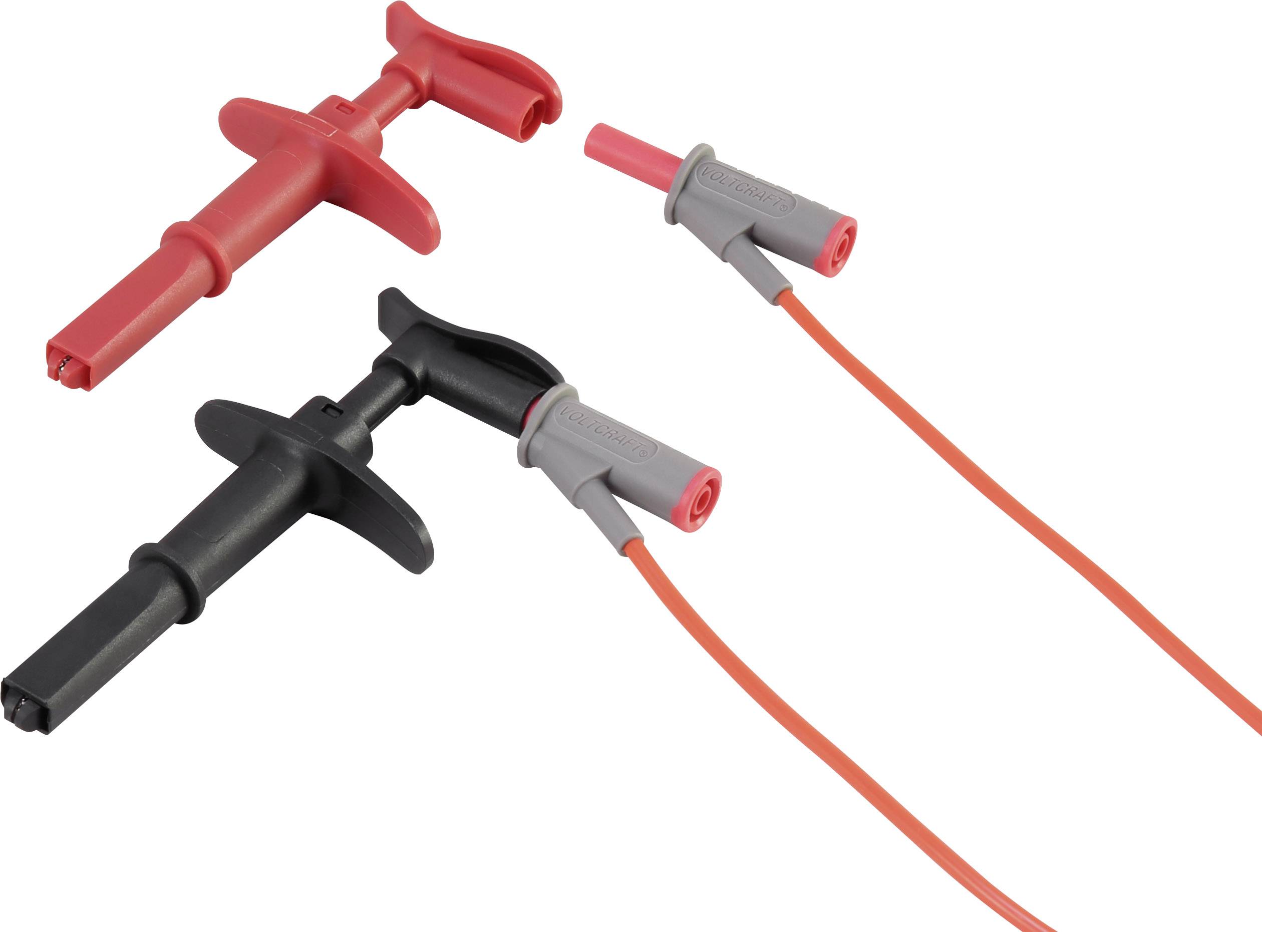 Dva elektrické měřicí hroty s kabely, jeden červený a jeden černý, určené pro testování elektrických obvodů.